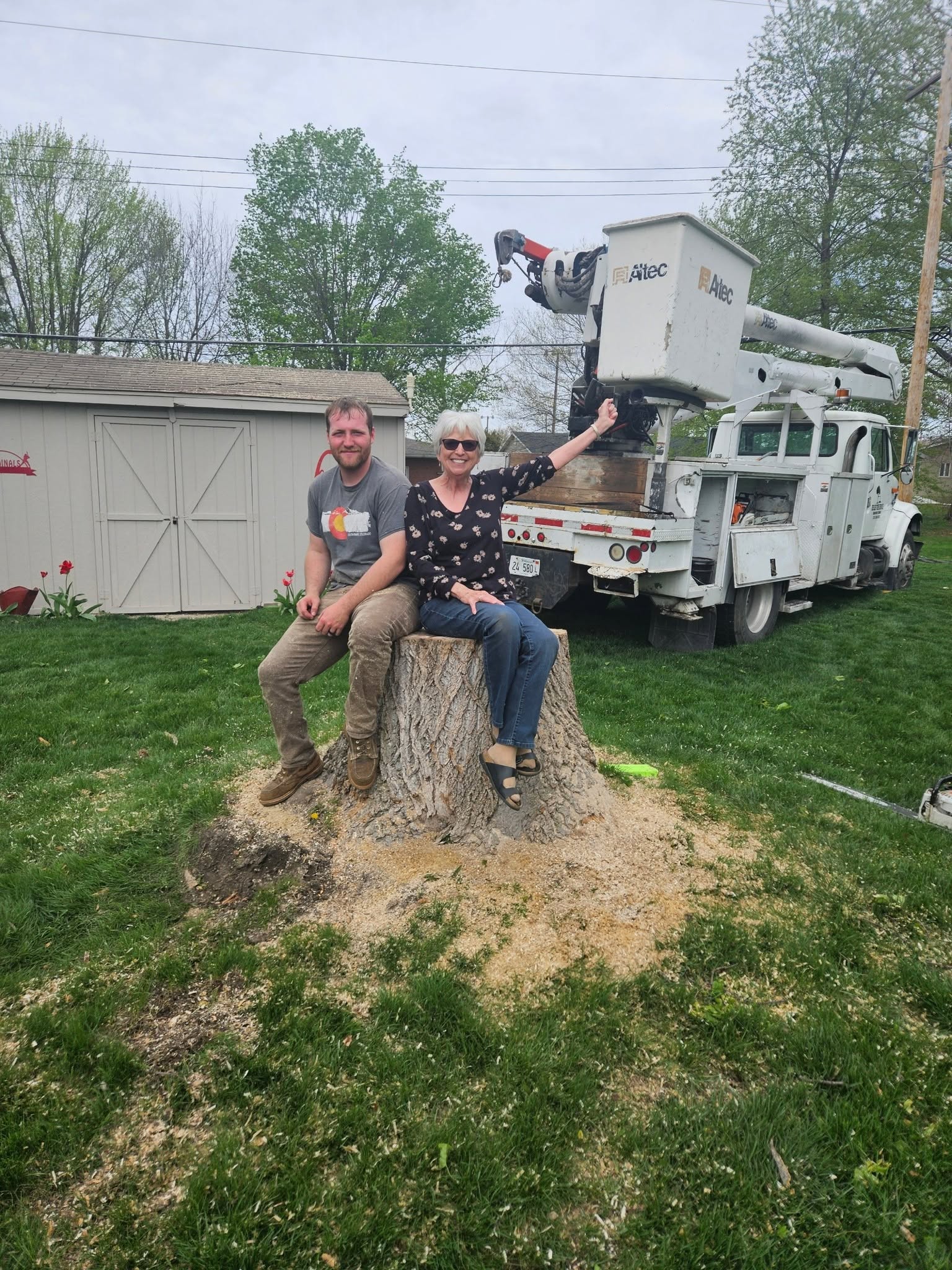 Bucket truck behind the foreman and customer